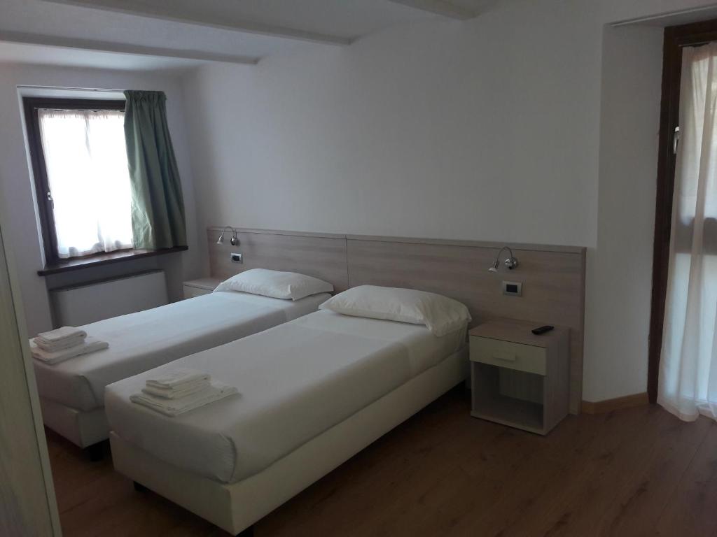 Postel nebo postele na pokoji v ubytování Albergo Diffuso Belvedere