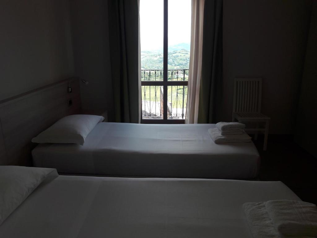 Postel nebo postele na pokoji v ubytování Albergo Diffuso Belvedere