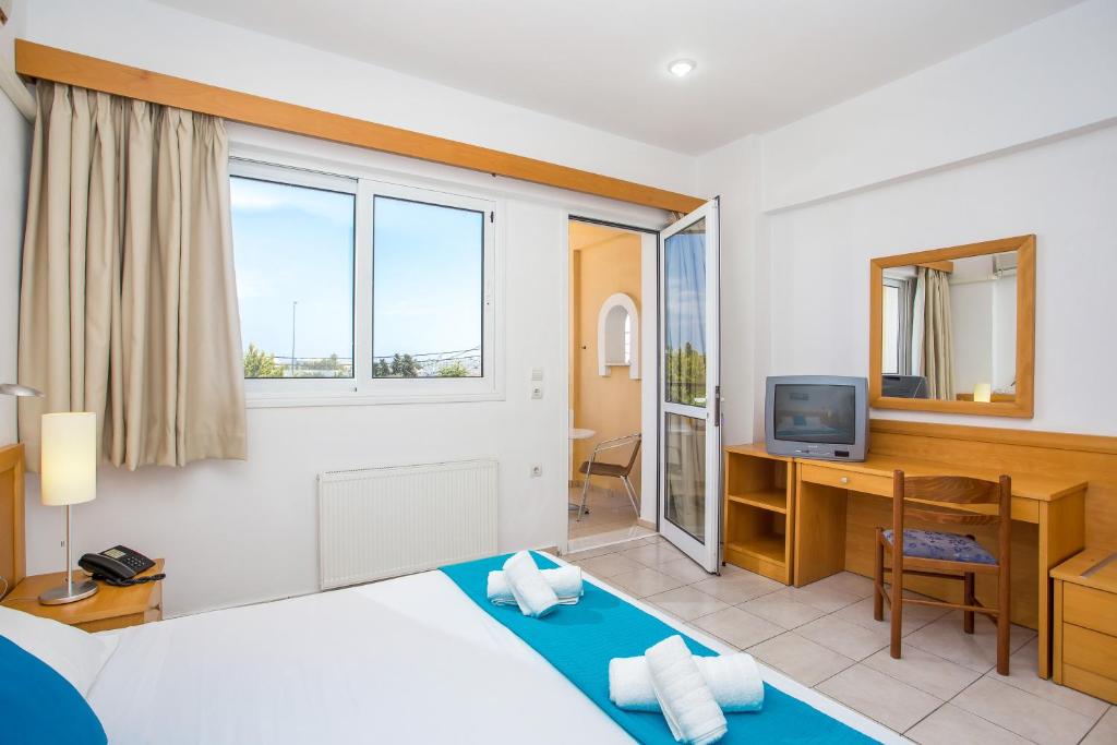 Postel nebo postele na pokoji v ubytování Mon Repos Hotel