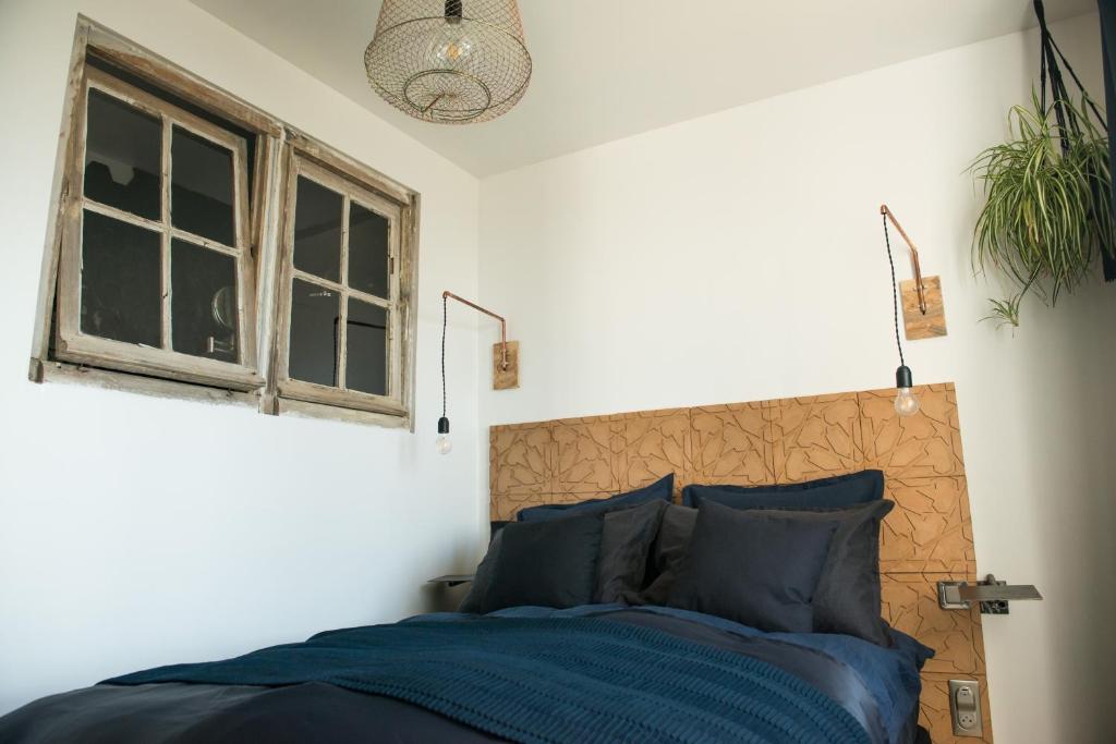 Postel nebo postele na pokoji v ubytování -LA CORDIALITÉ-