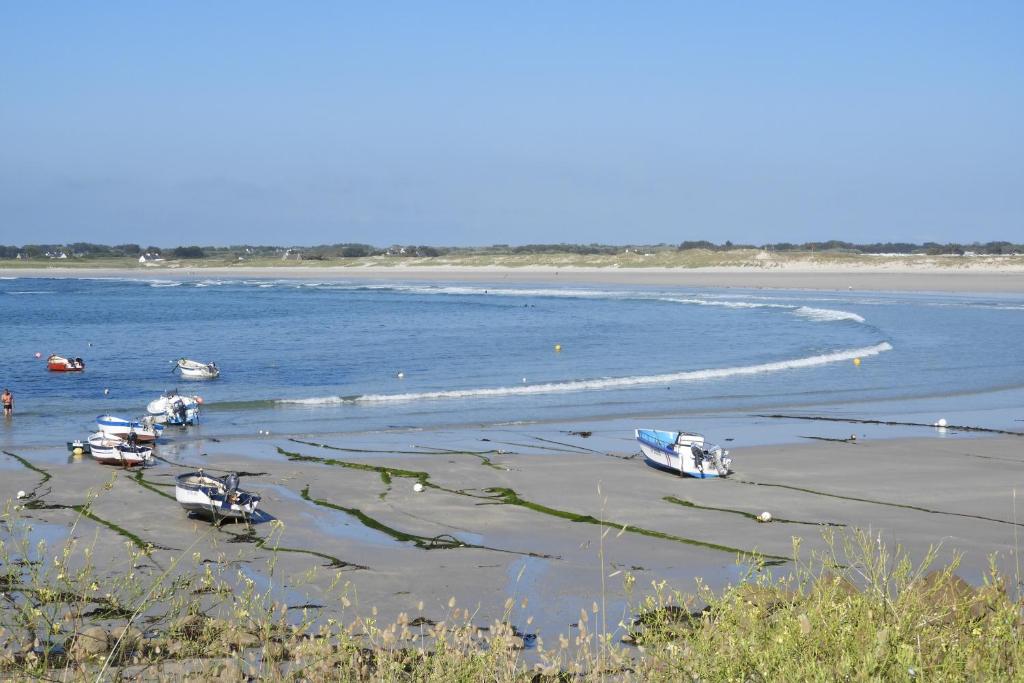 a group of boats sitting in the water at les volets bleus in Saint-Guénolé