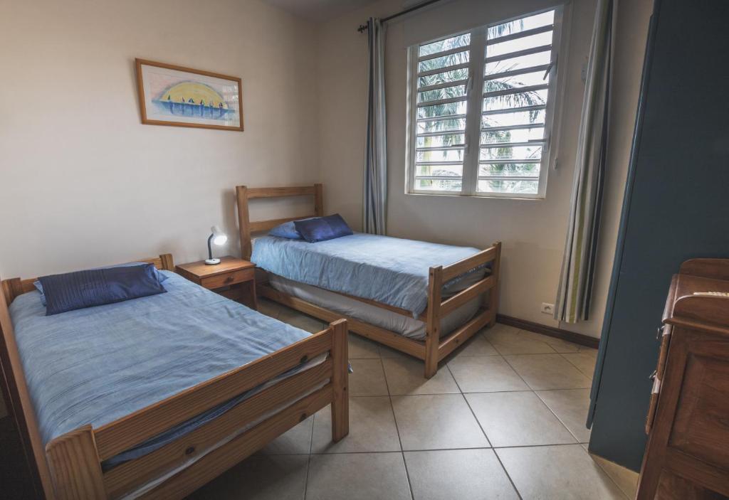 Postel nebo postele na pokoji v ubytování Villa Bayswater