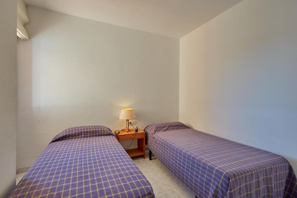 Postel nebo postele na pokoji v ubytování Apartaments Sa Guilla
