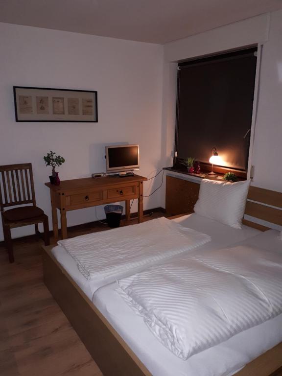 Postel nebo postele na pokoji v ubytování Herberg Die alte Schleuse