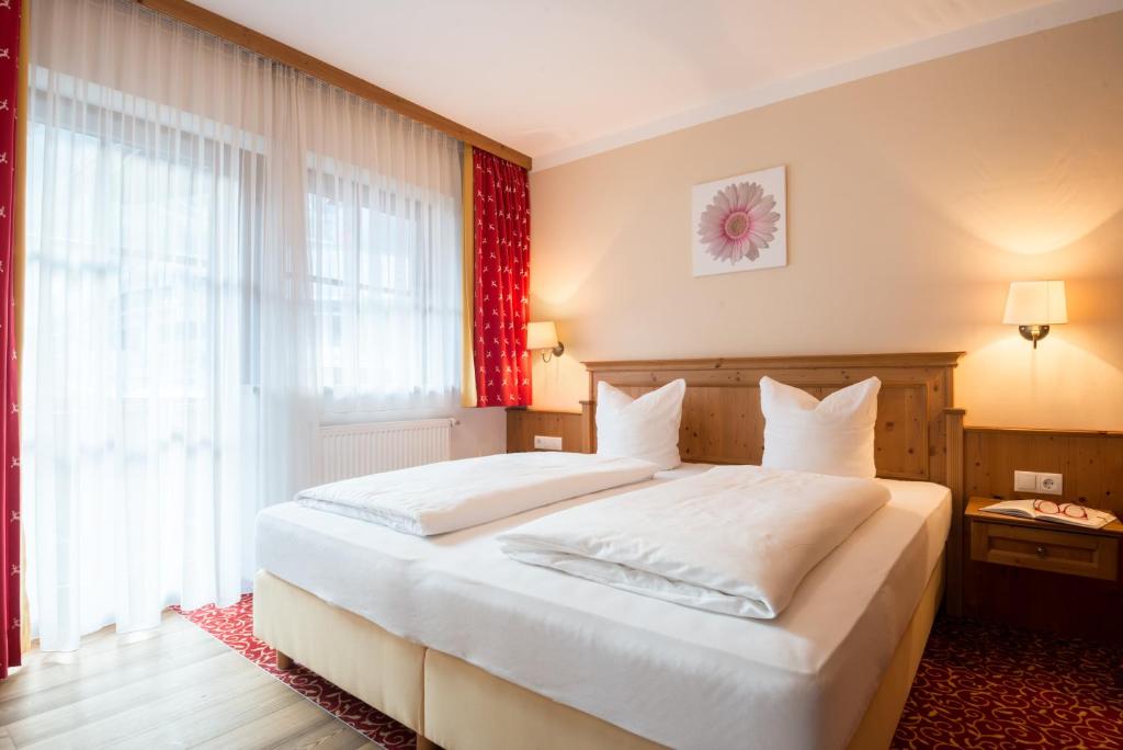 Posteľ alebo postele v izbe v ubytovaní Alpenchalet Brücke