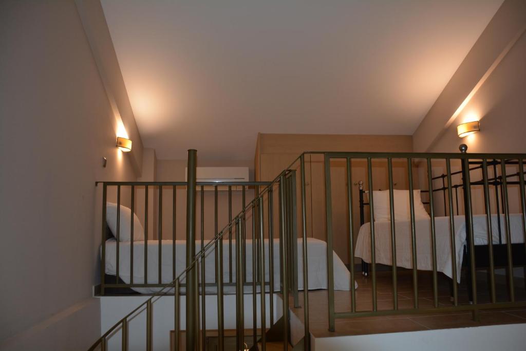 Postel nebo postele na pokoji v ubytování Royalty Suites Seaside