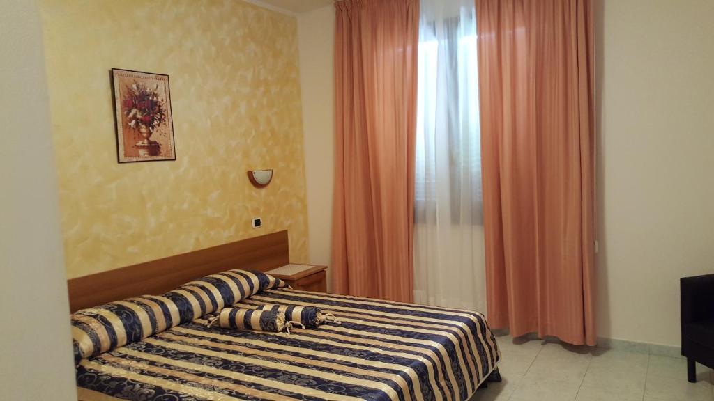 Postel nebo postele na pokoji v ubytování Sogno Sulcitano Masainas
