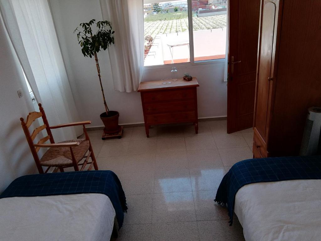 Postel nebo postele na pokoji v ubytování Casa Algaida
