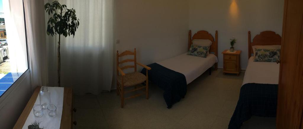 Postel nebo postele na pokoji v ubytování Casa Algaida