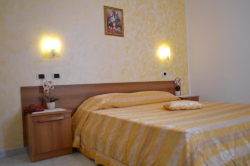 Postel nebo postele na pokoji v ubytování Sogno Sulcitano Masainas