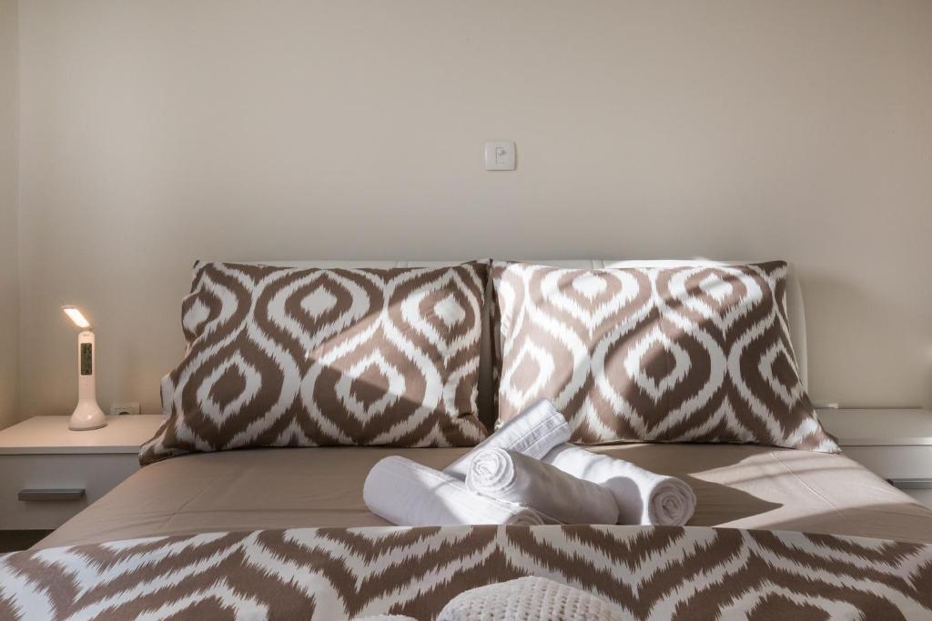 Postel nebo postele na pokoji v ubytování Memories Apartments
