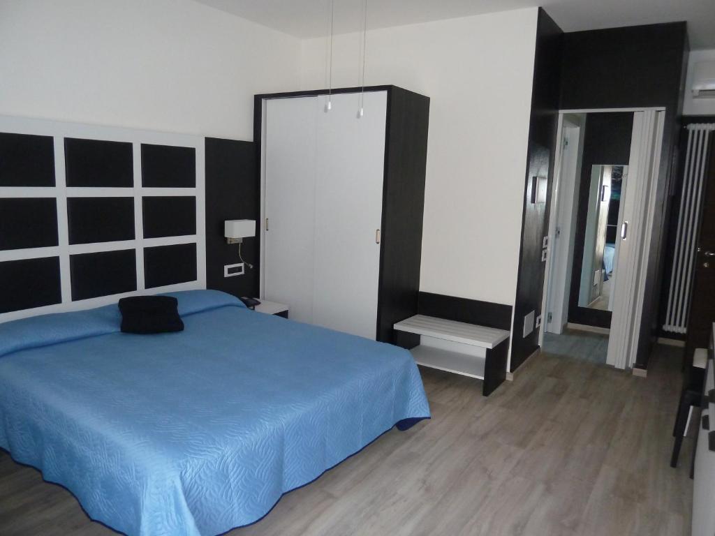 Postel nebo postele na pokoji v ubytování Albergo Casa Este