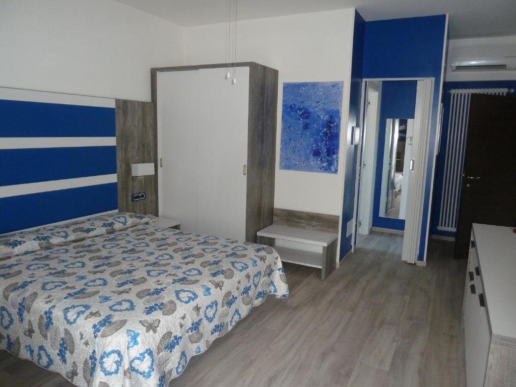 Postel nebo postele na pokoji v ubytování Albergo Casa Este