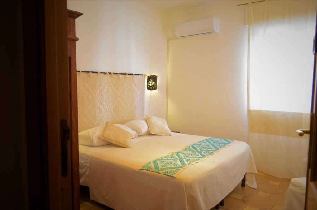 Postel nebo postele na pokoji v ubytování Antonhouse Alghero