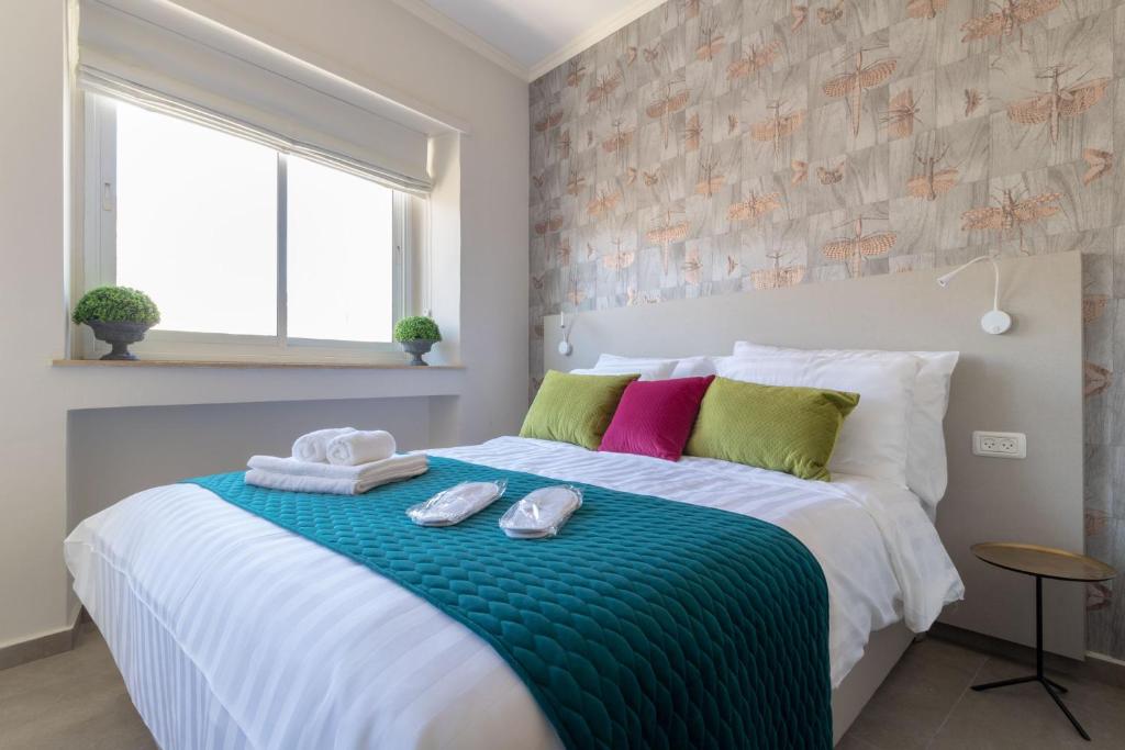 Posteľ alebo postele v izbe v ubytovaní DEM Hotel