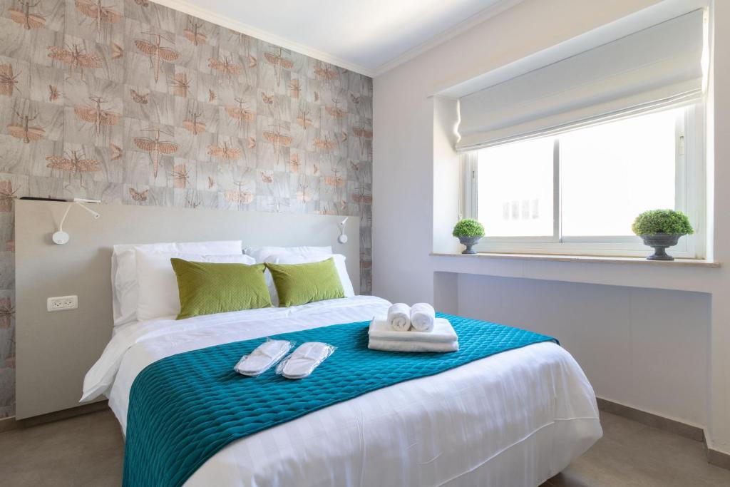 Posteľ alebo postele v izbe v ubytovaní DEM Hotel