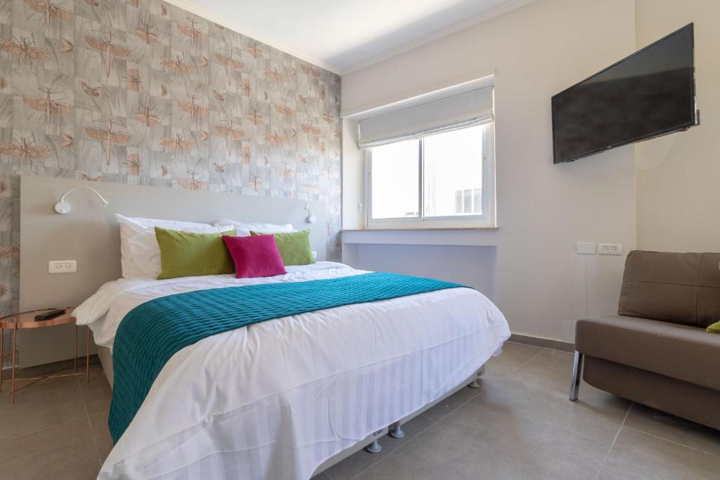 Posteľ alebo postele v izbe v ubytovaní DEM Hotel