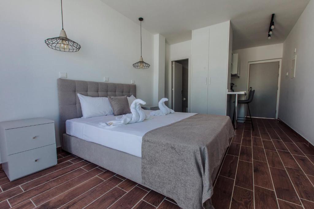 a bedroom with a bed with white towels on it at River View Boutique Apts in Ayia Napa
