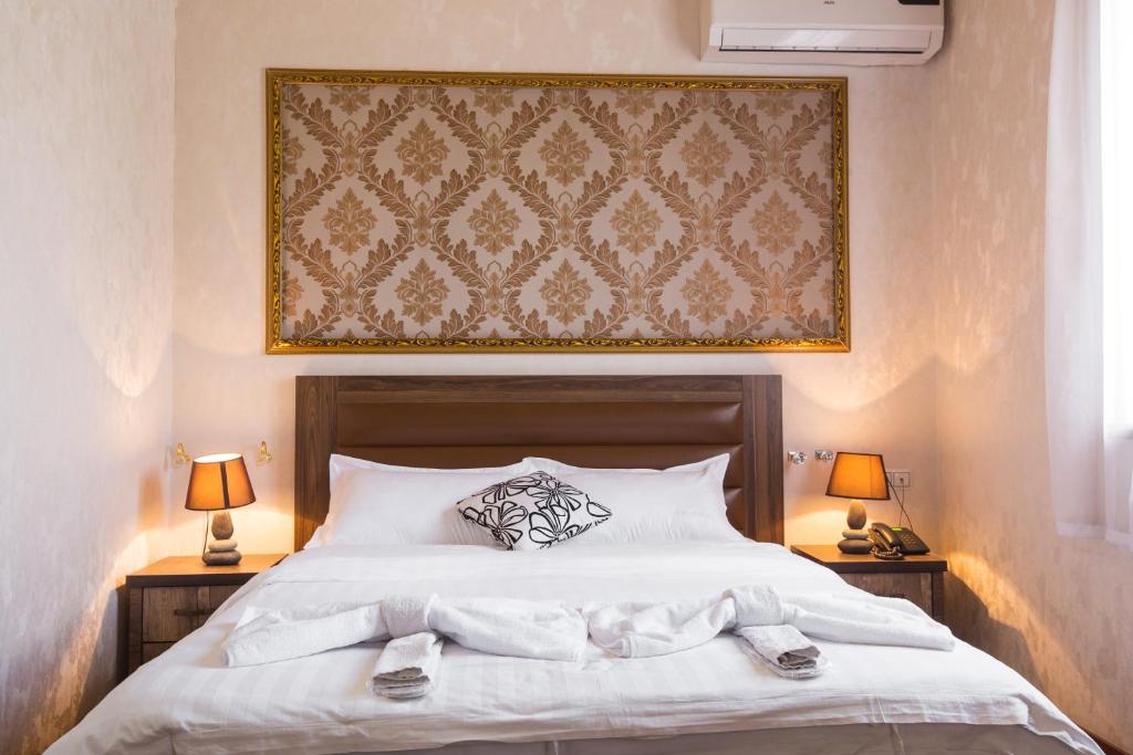 Кровать или кровати в номере Hotel Garden House