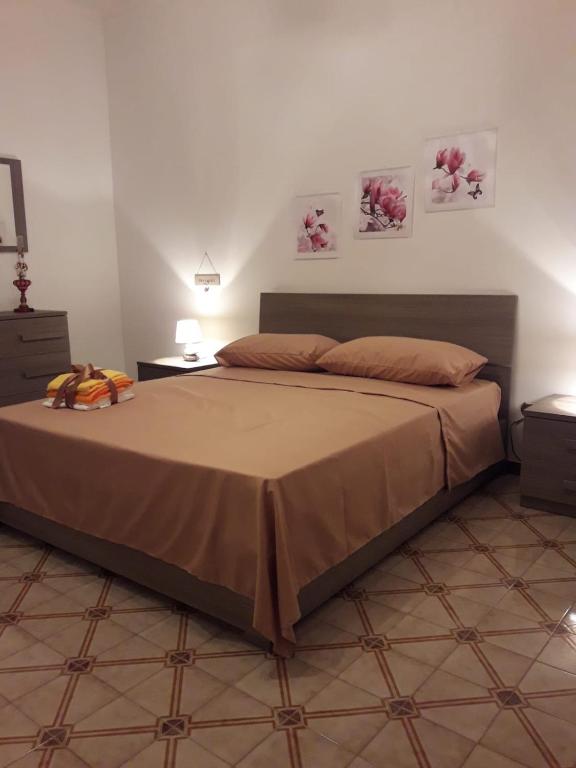Postel nebo postele na pokoji v ubytování I Fiori Di Lucrezia