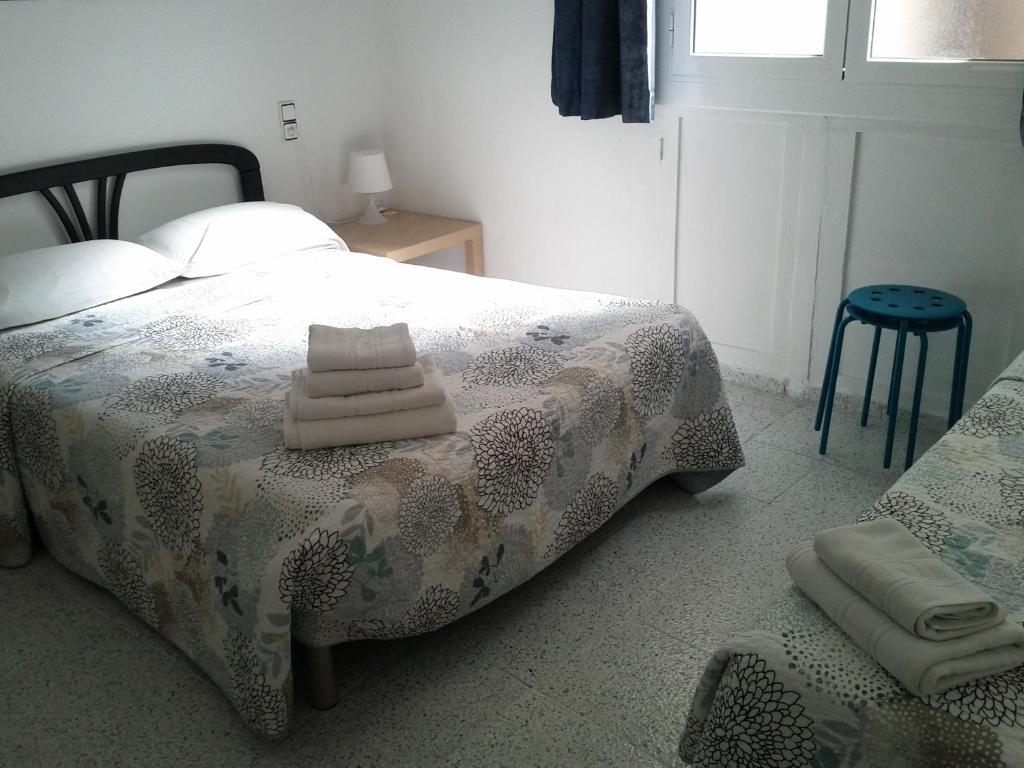 Postel nebo postele na pokoji v ubytování Hostal River