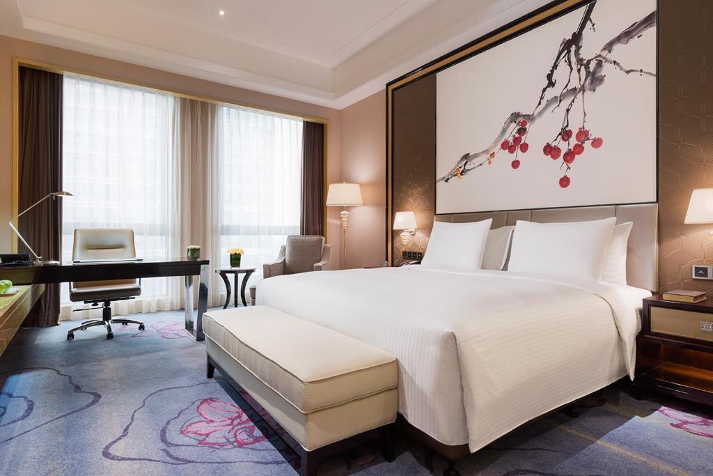 Postel nebo postele na pokoji v ubytování Wanda Realm Guangzhou Zengcheng
