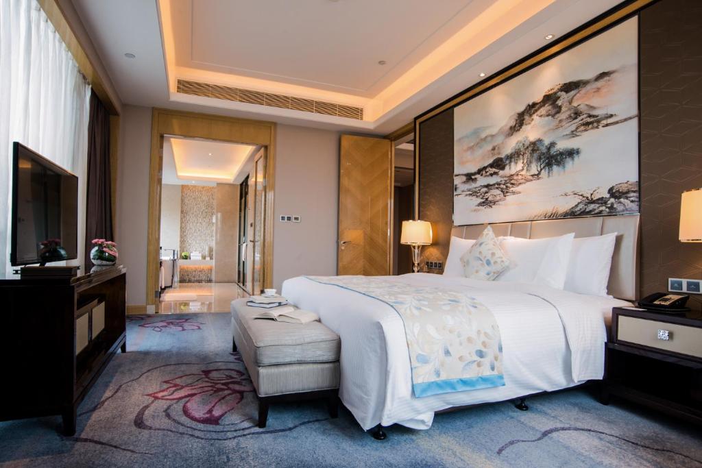 Postel nebo postele na pokoji v ubytování Wanda Realm Guangzhou Zengcheng