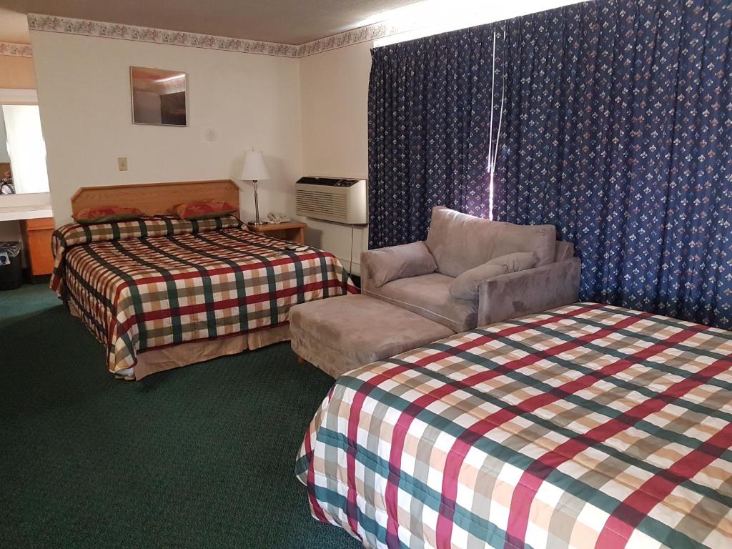 Postel nebo postele na pokoji v ubytování Townhouse Motel