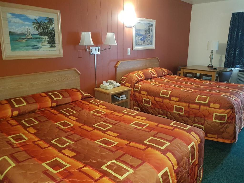 Postel nebo postele na pokoji v ubytování Townhouse Motel