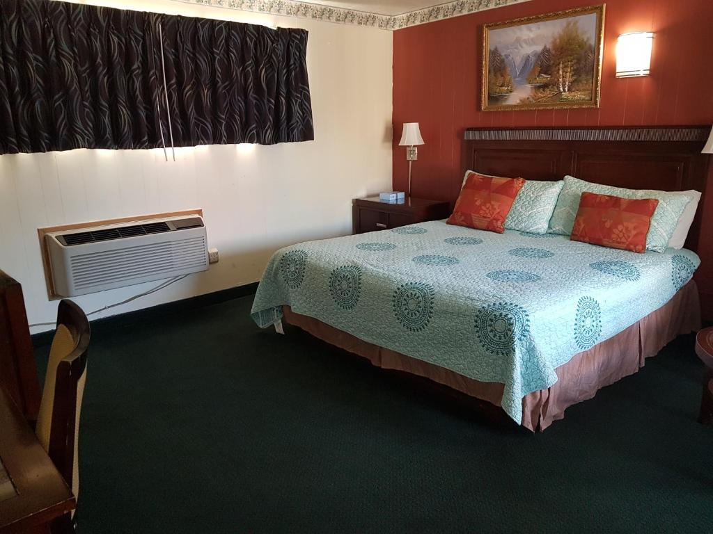 Postel nebo postele na pokoji v ubytování Townhouse Motel