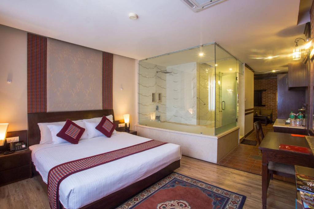 Postel nebo postele na pokoji v ubytování Hotel Marshyangdi