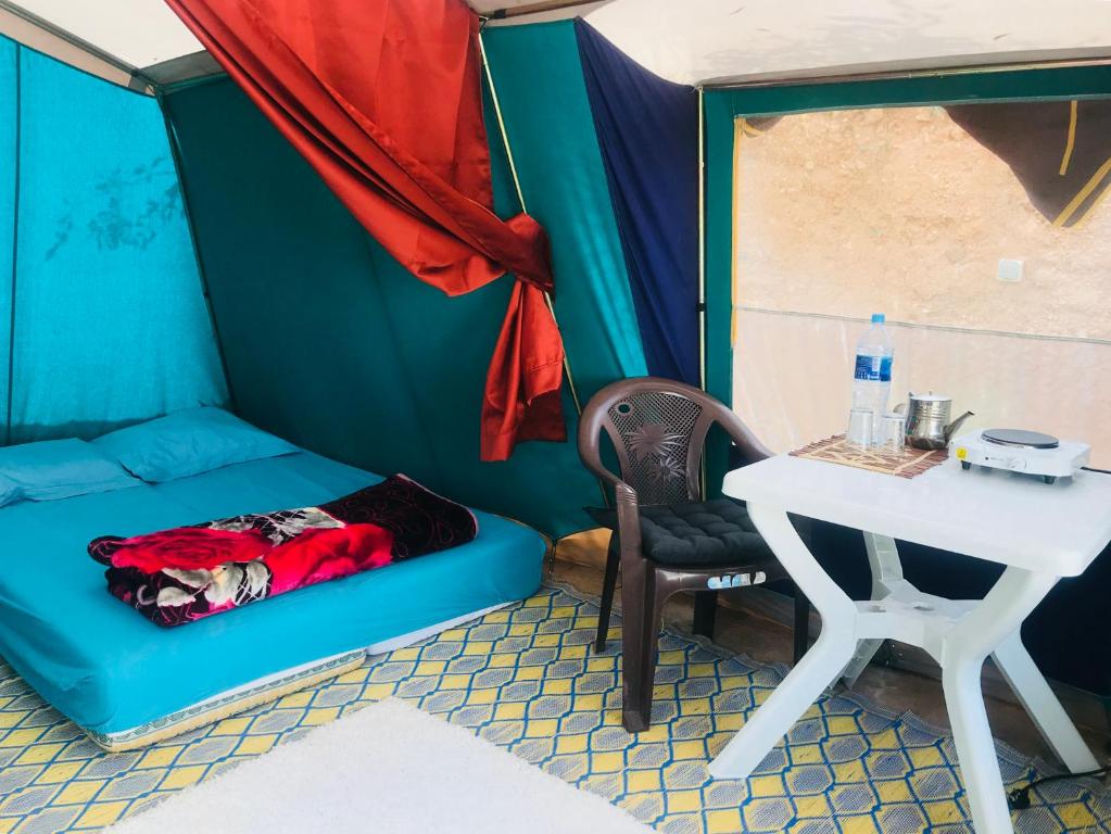 a small room with a couch and a table at Gite Le Nomade in Mirleft