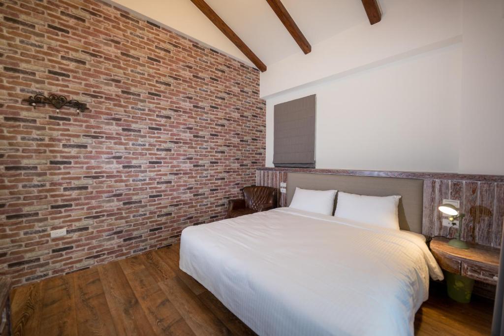 Postel nebo postele na pokoji v ubytování R&J Guesthouse