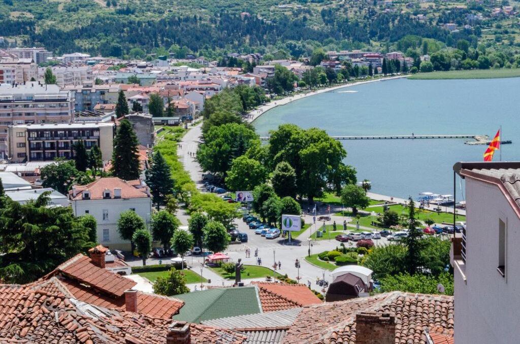 a view of a town with a lake and buildings at Bochkar Guest House in Ohrid