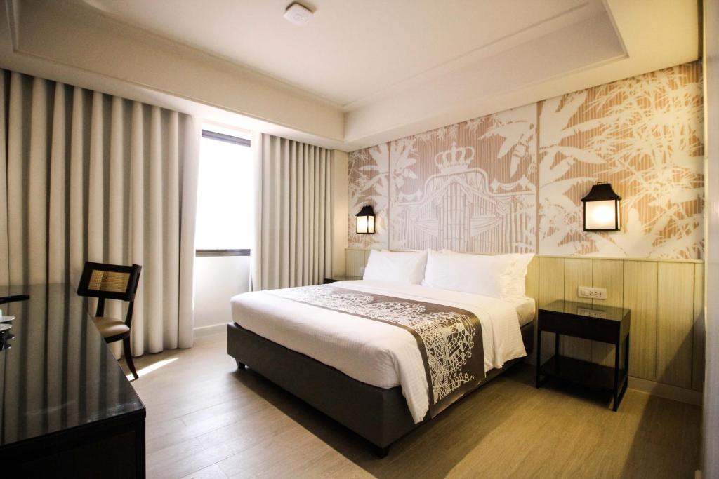 Postel nebo postele na pokoji v ubytování Mella Hotel