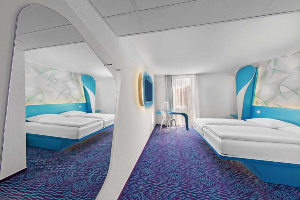 Postel nebo postele na pokoji v ubytování Prize by Radisson, Hamburg St Pauli