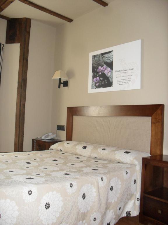 Postel nebo postele na pokoji v ubytování Hotel Zerbinetta