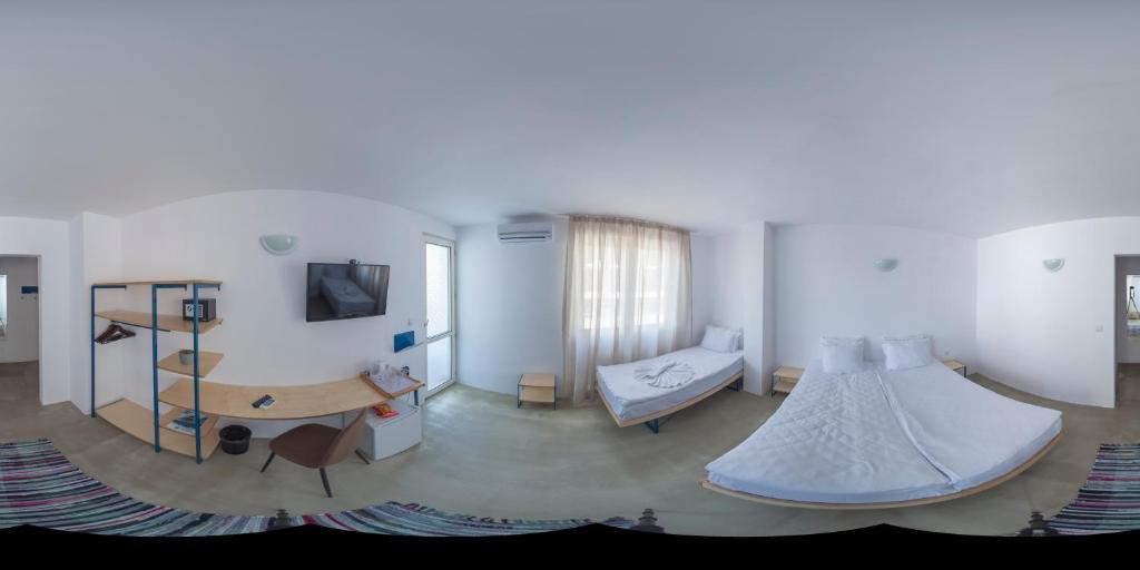 Postel nebo postele na pokoji v ubytování Hotel Mistral