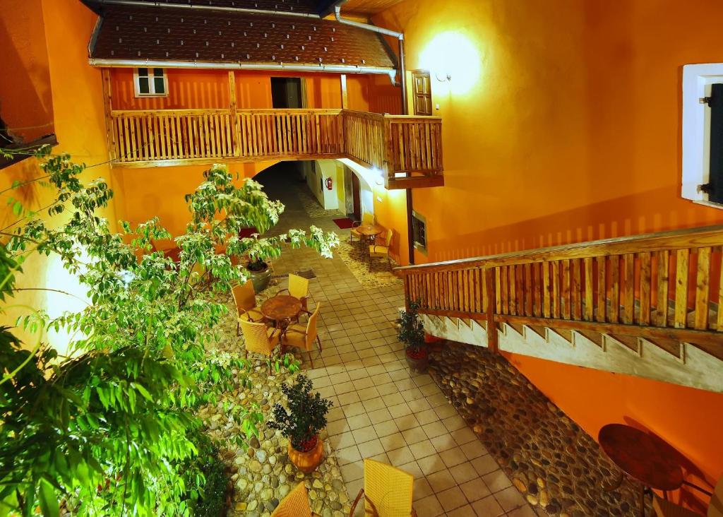 an overhead view of a building with a courtyard with plants at Bed & Breakfast Šilak in Ptuj