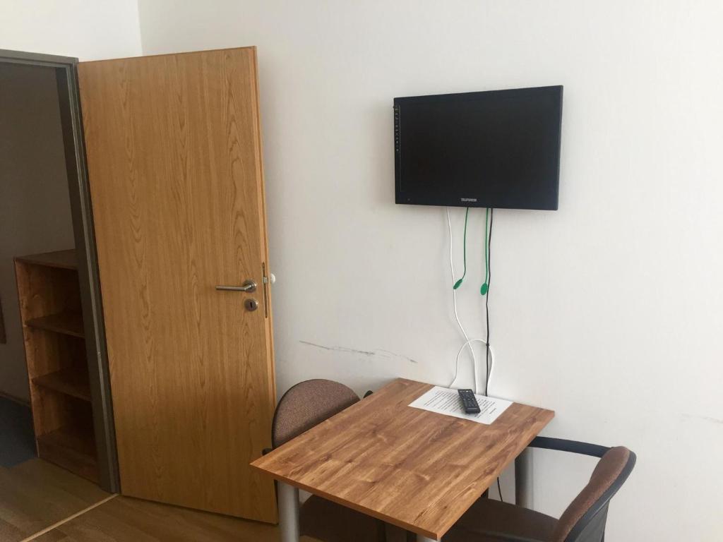 TV a/nebo společenská místnost v ubytování Hotel Můstek