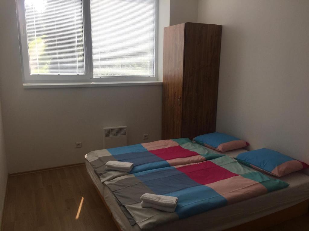 Postel nebo postele na pokoji v ubytování Hotel Můstek