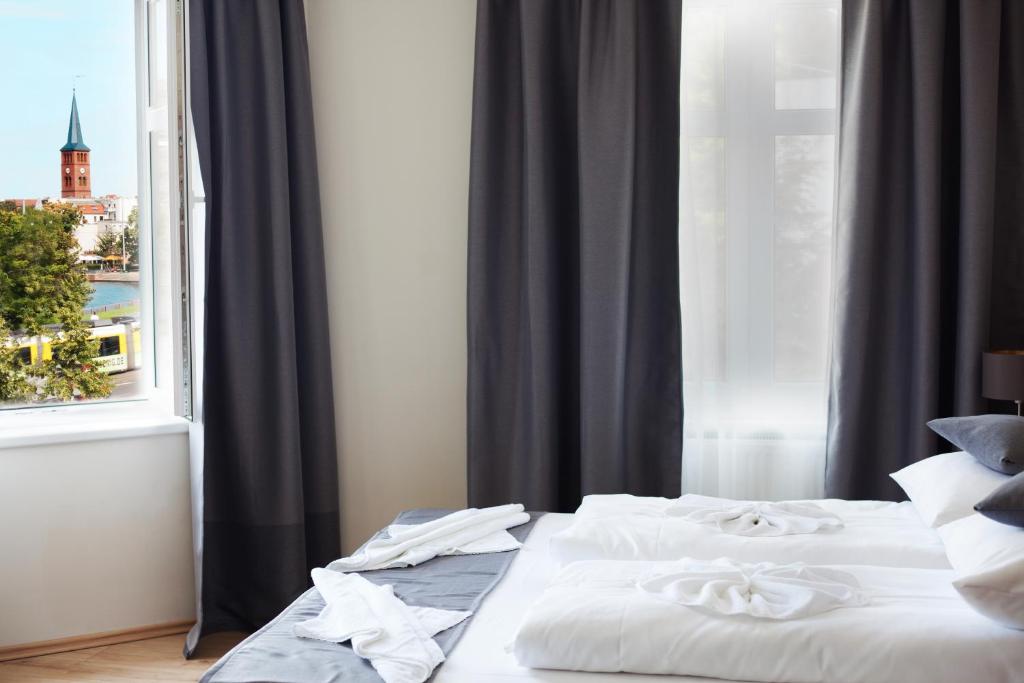 Postel nebo postele na pokoji v ubytování Hotel Bett und Buch