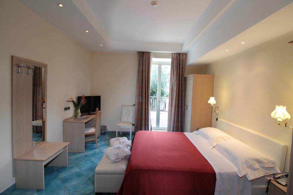 Postel nebo postele na pokoji v ubytování Hotel Regina Palace Terme