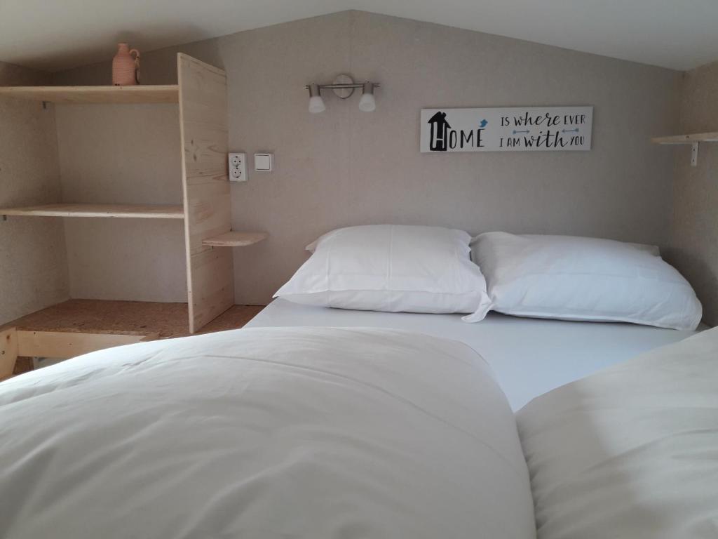 Postel nebo postele na pokoji v ubytování Tiny House