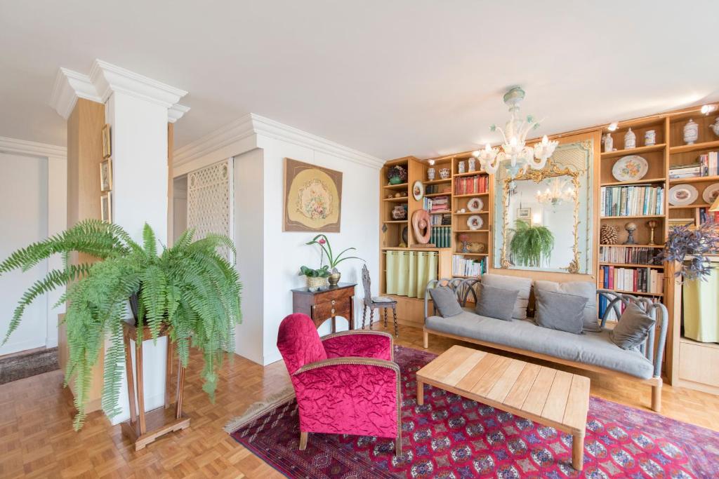 a living room with a couch and a table at Veeve - Apartment near Pont de Grenelle in Paris