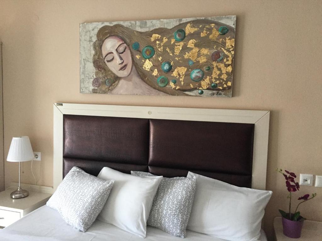 Postel nebo postele na pokoji v ubytování Alexandros Hotel