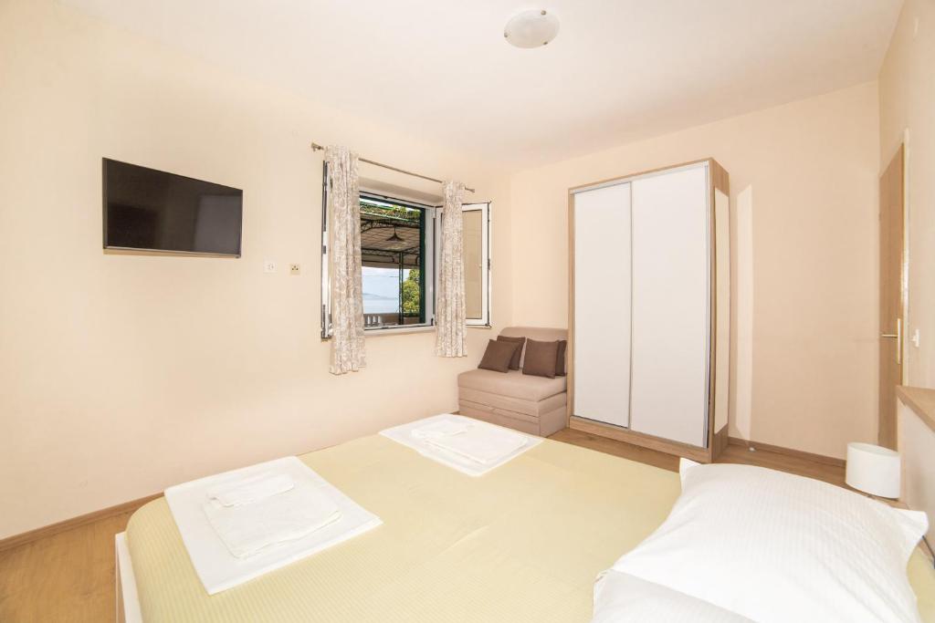 Postel nebo postele na pokoji v ubytování Apartment Cvita