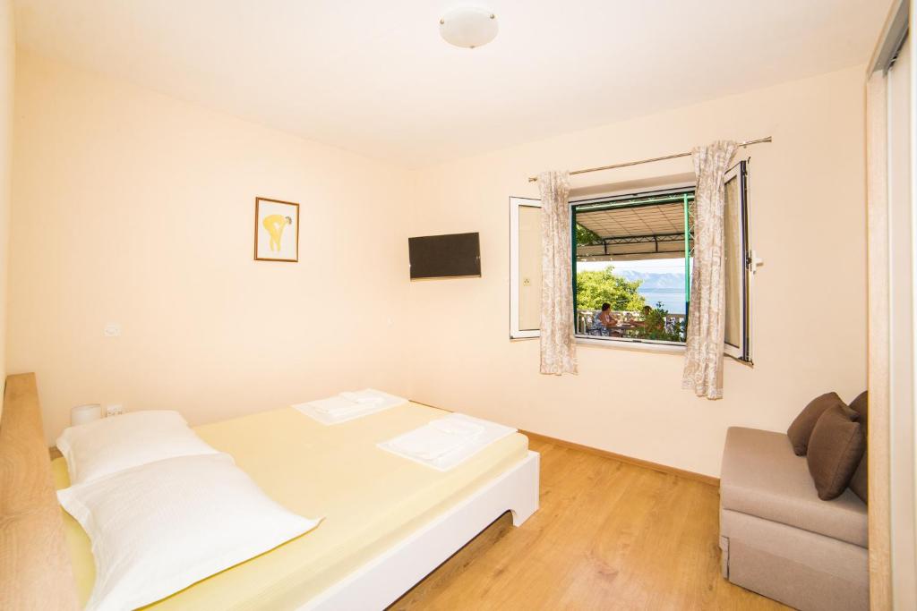 Postel nebo postele na pokoji v ubytování Apartment Cvita