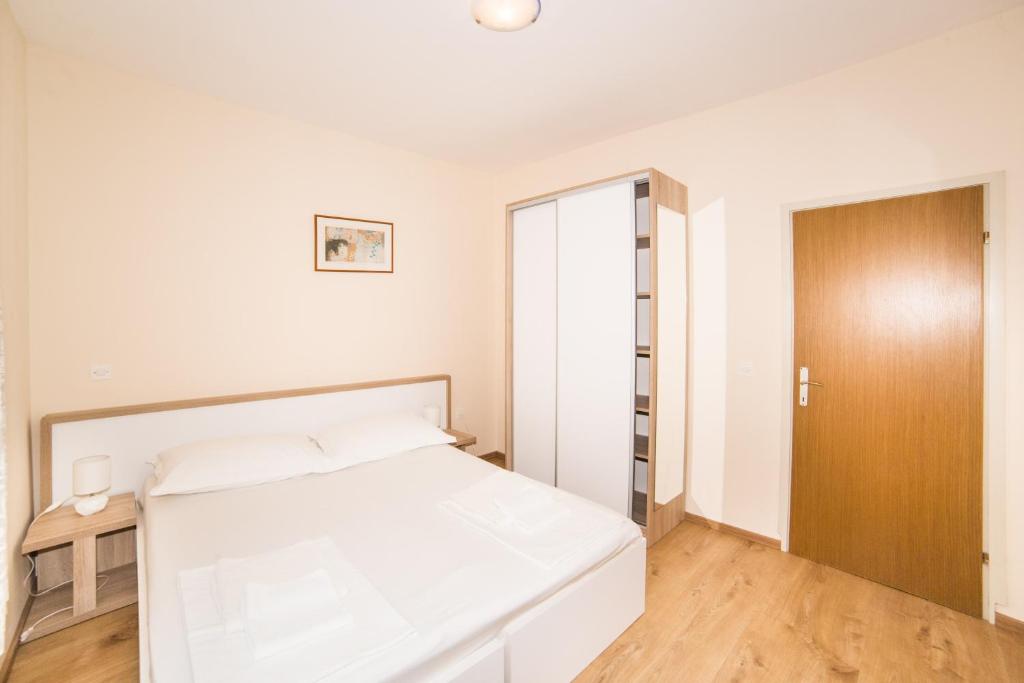 Postel nebo postele na pokoji v ubytování Apartment Cvita