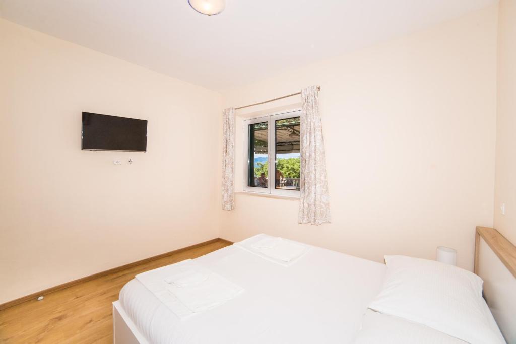 Postel nebo postele na pokoji v ubytování Apartment Cvita